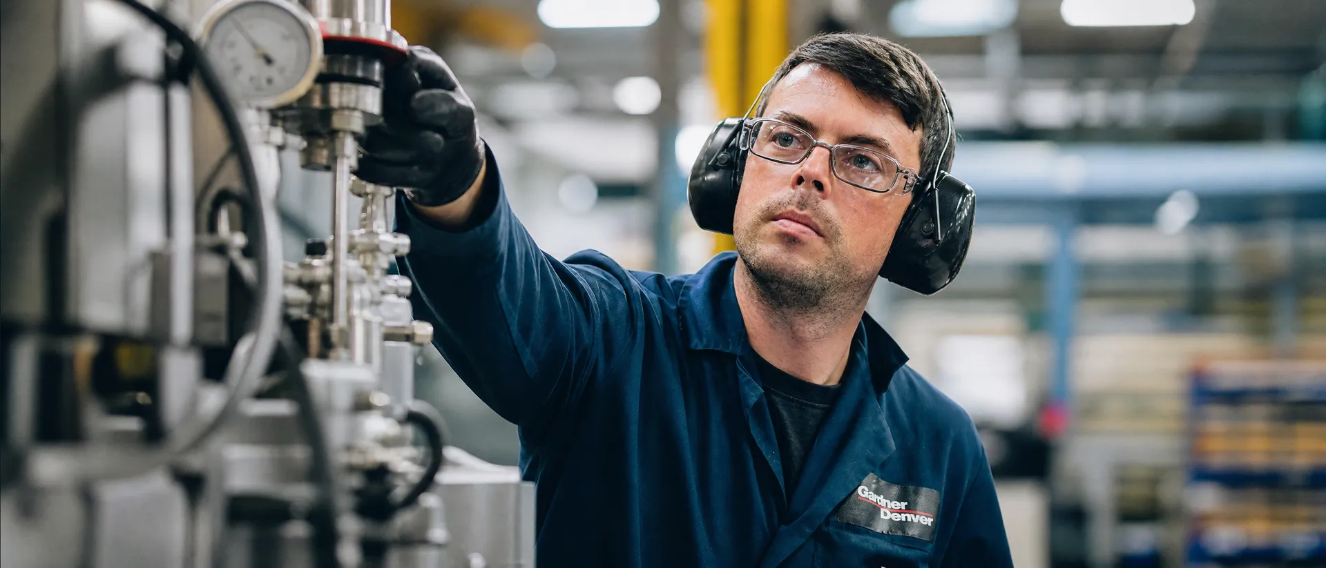 Adroit Report Suite - operator inspecting industrial equipment