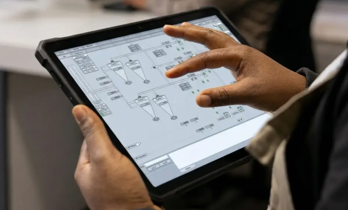 Engineer working on MAPS SCADA system on tablet